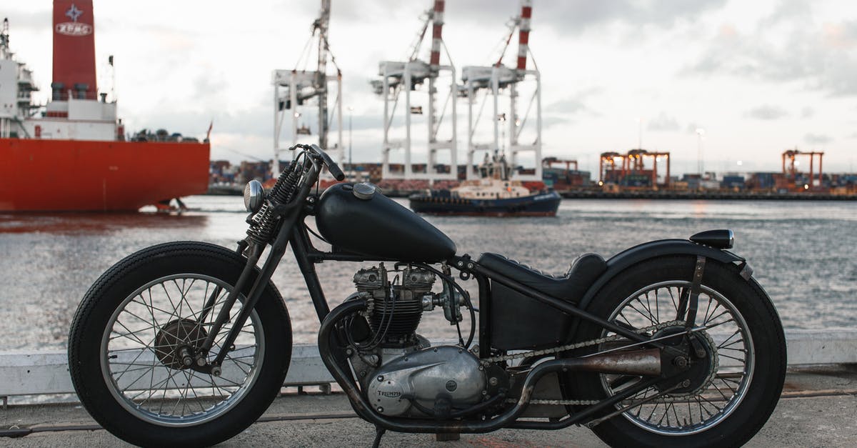 Pokemon Go compatibility with Moto E 2nd gen - Retro motorbike in river port against ships Pokemon Go compatibility with Moto E 2nd gen - Retro motorbike in river port against ships