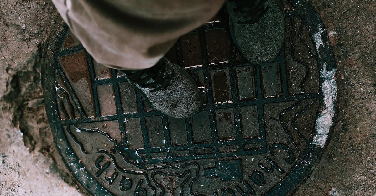 Pokemon Go cuts all audio on boot. Any way to dodge that? - From above anonymous person in boots and pants standing on shabby metal manhole lid on city street