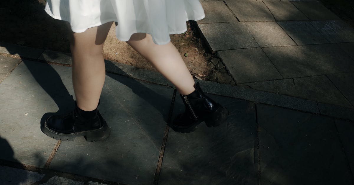 Pokemon Go cuts all audio on boot. Any way to dodge that? - From above of crop faceless female in white dress and black boots waling on path in park