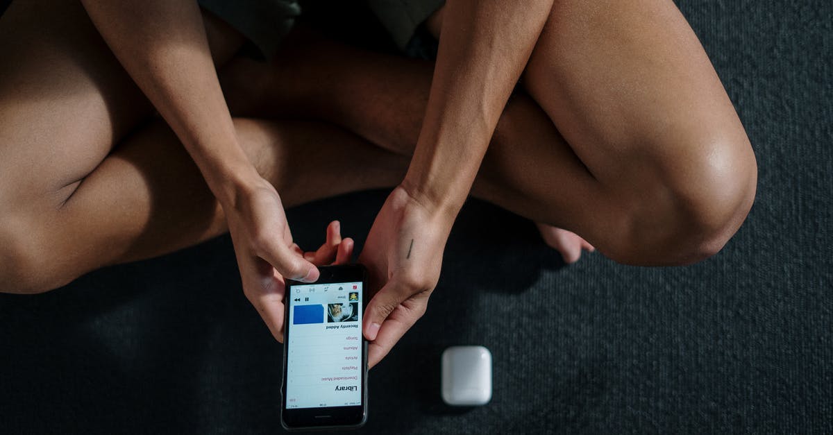 Pokemon Go: Gym Badge Over-completed? - Person Holding Black Android Smartphone