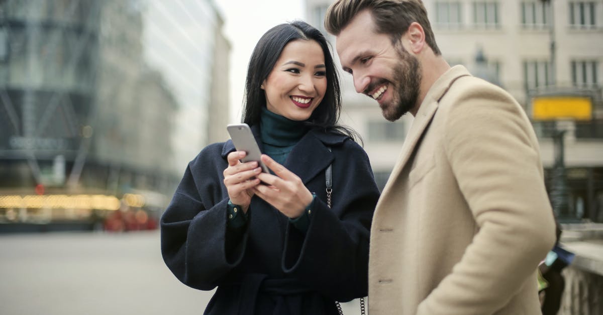 Pokemon Go not showing where I capture the Pokemon - Couple Standing Near Buildings