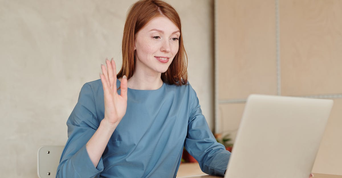 Possible To Raise Associate Salary In GTA Online As A CEO? - Woman Raising Her Hand While Sitting In Front of the Laptop 