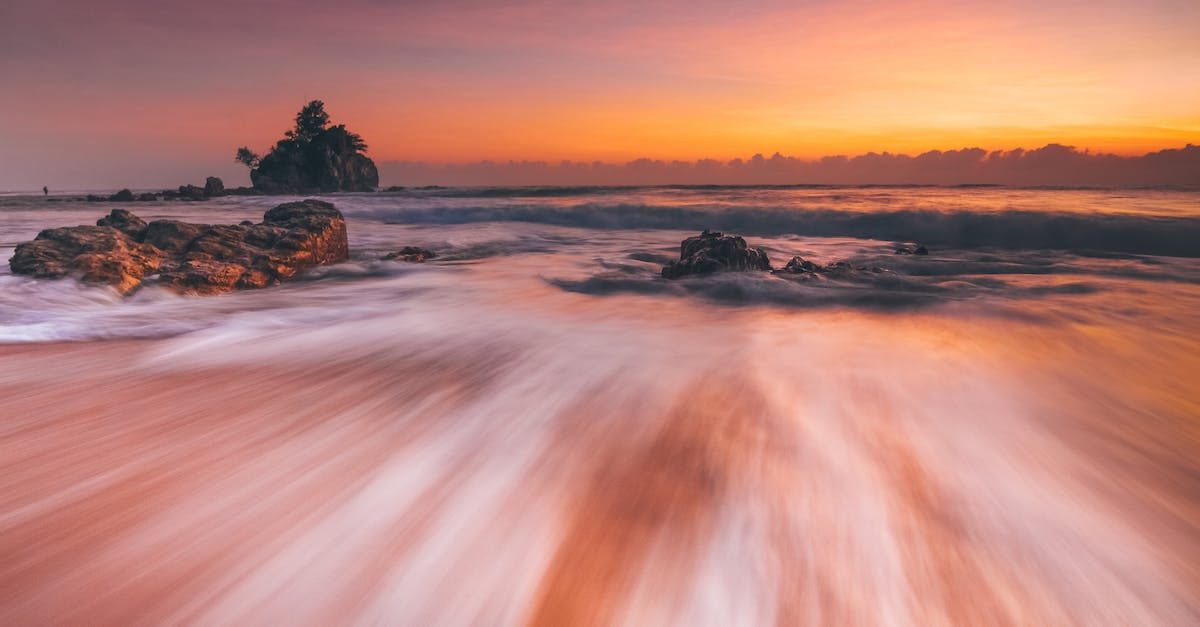 Power Charges - How long? How many? - Stormy sea with fast water flow on beach at sunset Power Charges - How long? How many? - Stormy sea with fast water flow on beach at sunset