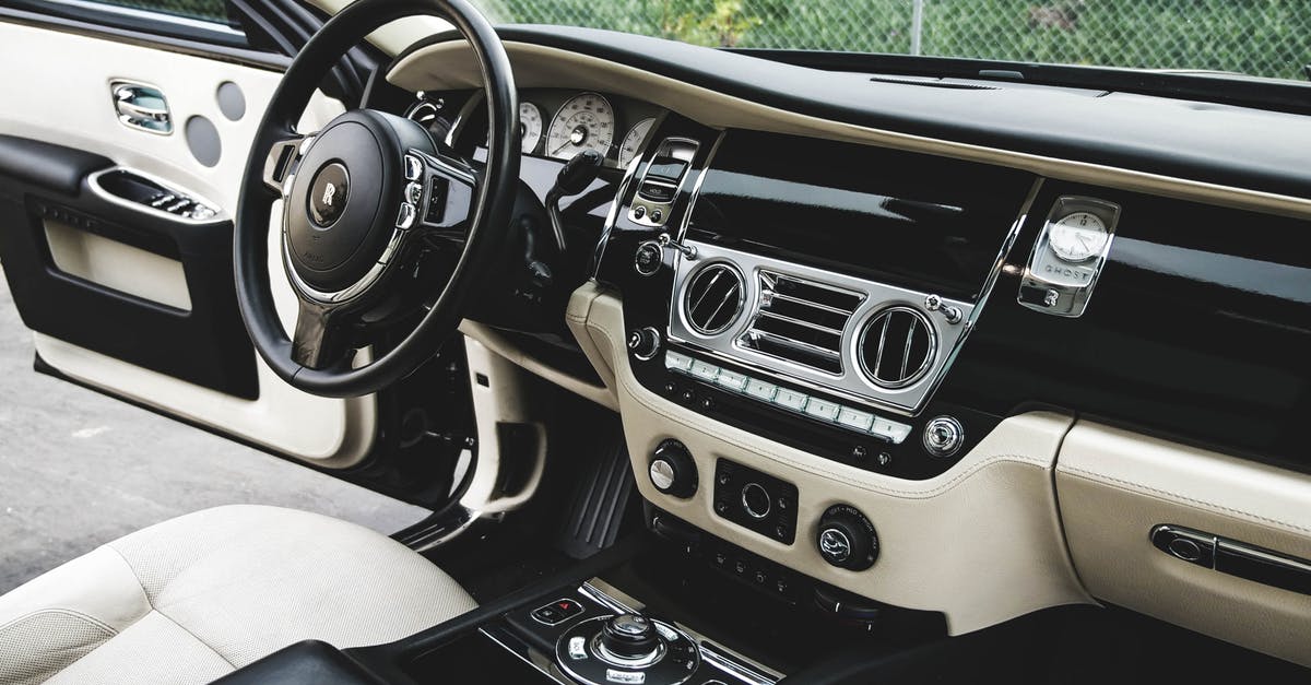 Premium Membership bonus rate? - Expensive luxury car interior with white leather seats and shiny dashboard