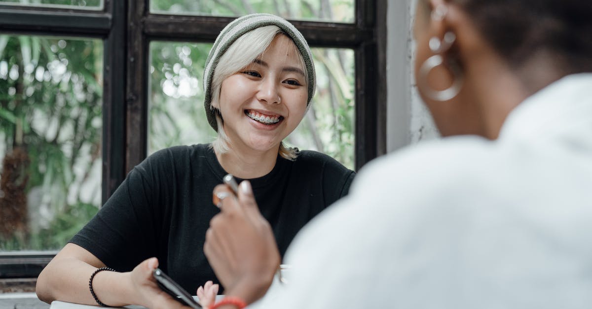 Preston Garvey won't talk to me at Sanctuary Hills! - Couple of diverse friends communicating in cafe