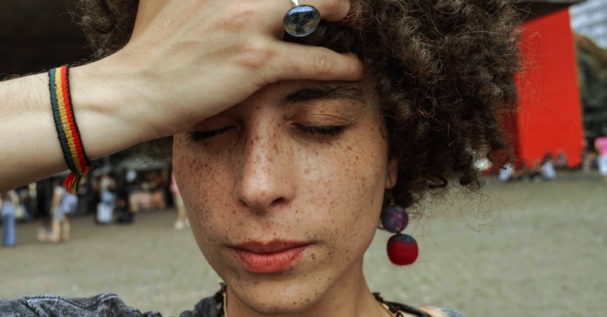 Pretty much all my heroes are stressed out. How can I come back? - Close-up Photo of Woman with Her Eyes Closed Holding Her Forehead 