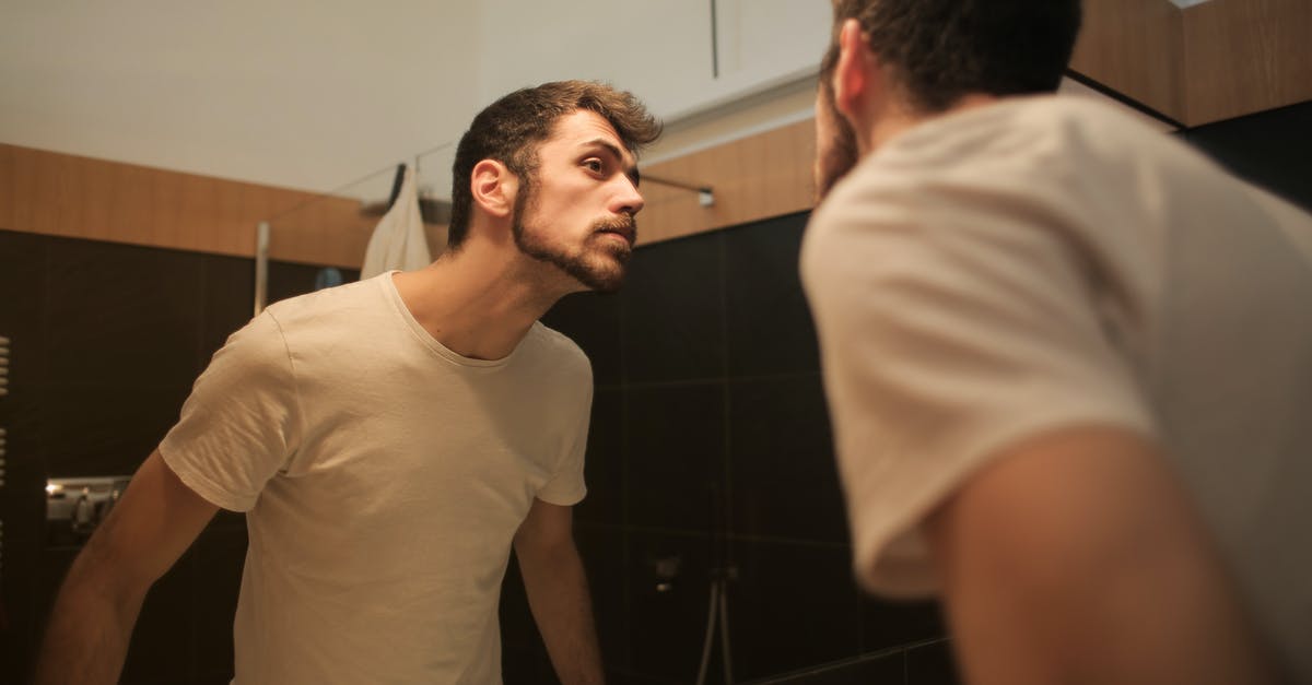 Prevent HTC Vive from disabling VR due to low performance - Stylish concentrated man looking in mirror in bathroom Prevent HTC Vive from disabling VR due to low performance - Stylish concentrated man looking in mirror in bathroom