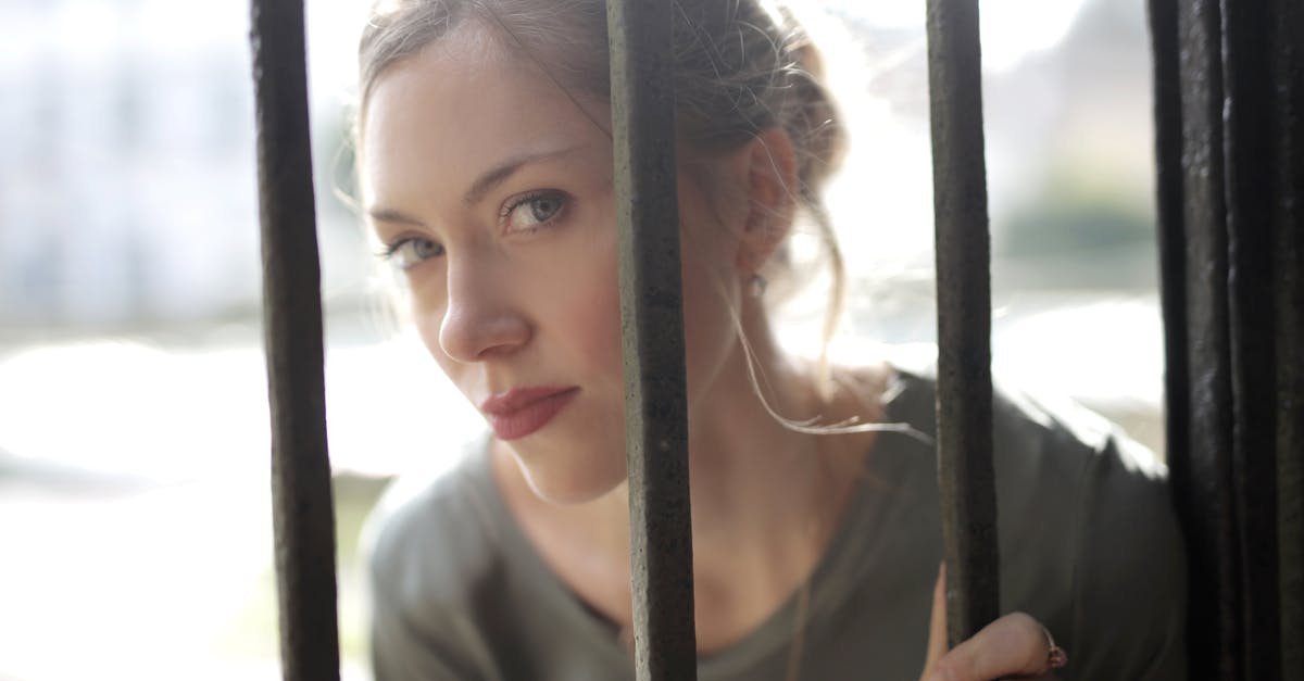 Preventing Iron golems from spawning outside the spawner platform? - Young beautiful female with bewitching look leaning on iron black bars and looking at camera while standing at fence on sunny day Preventing Iron golems from spawning outside the spawner platform? - Young beautiful female with bewitching look leaning on iron black bars and looking at camera while standing at fence on sunny day