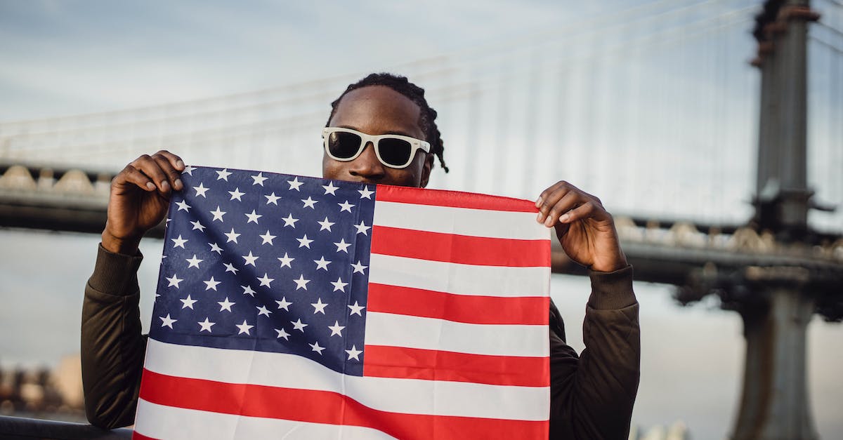 Print position in console - Friendly man with US flag kerchief in hands Print position in console - Friendly man with US flag kerchief in hands