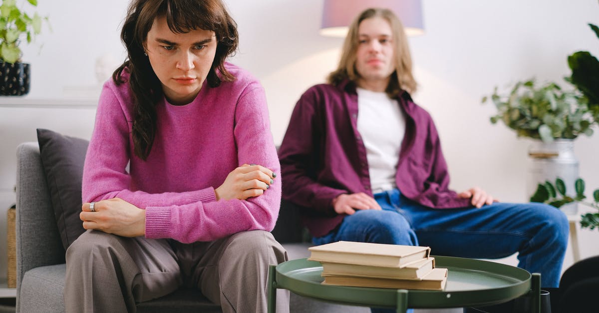 Problem jumping in Swordigo - Woman in Pink Sweater Sitting Beside Woman in Gray Sweater