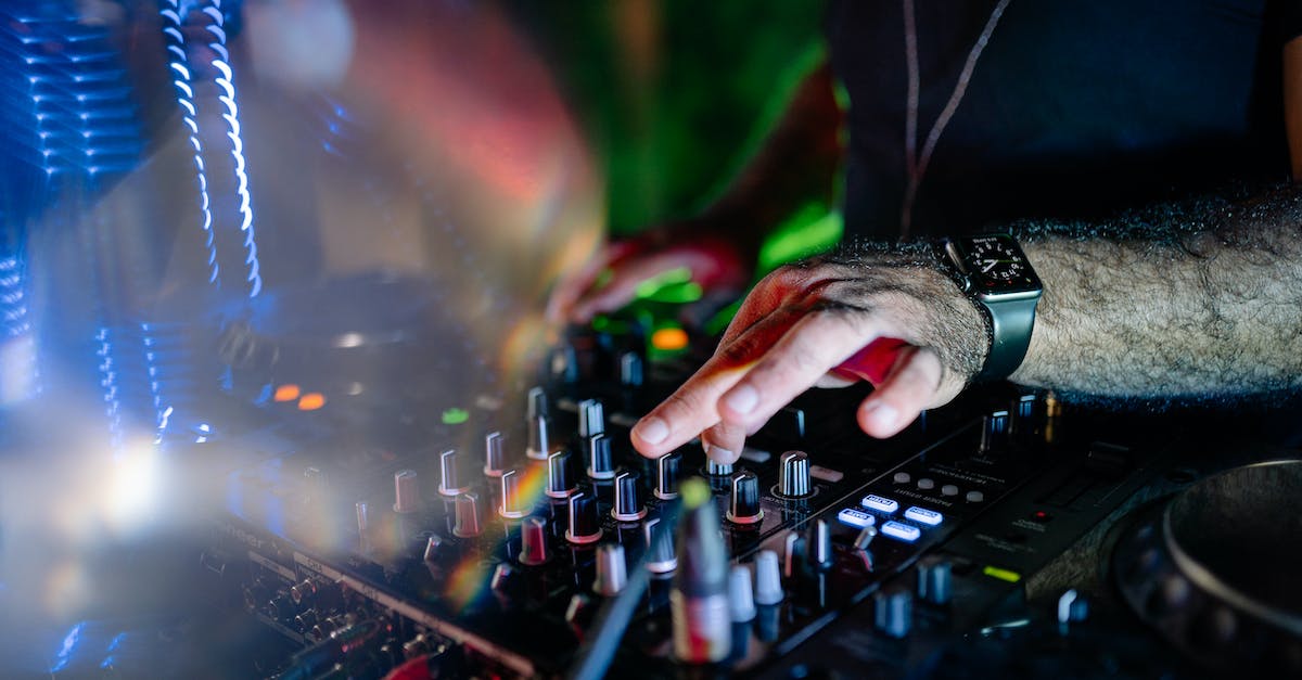 ps3 controller not turning on or syncing - A Person Turning the Knob on a Control Panel