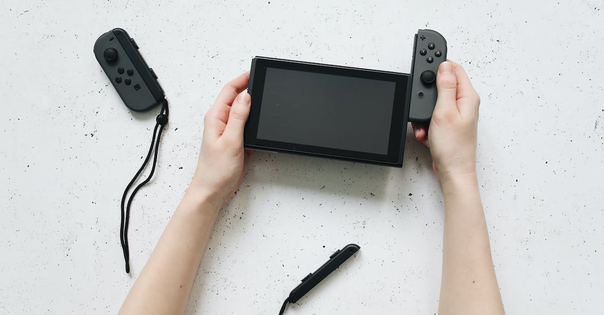 ps3 controllers not charging after 2 months - Person Holding Black Nintendo Game Boy ps3 controllers not charging after 2 months - Person Holding Black Nintendo Game Boy
