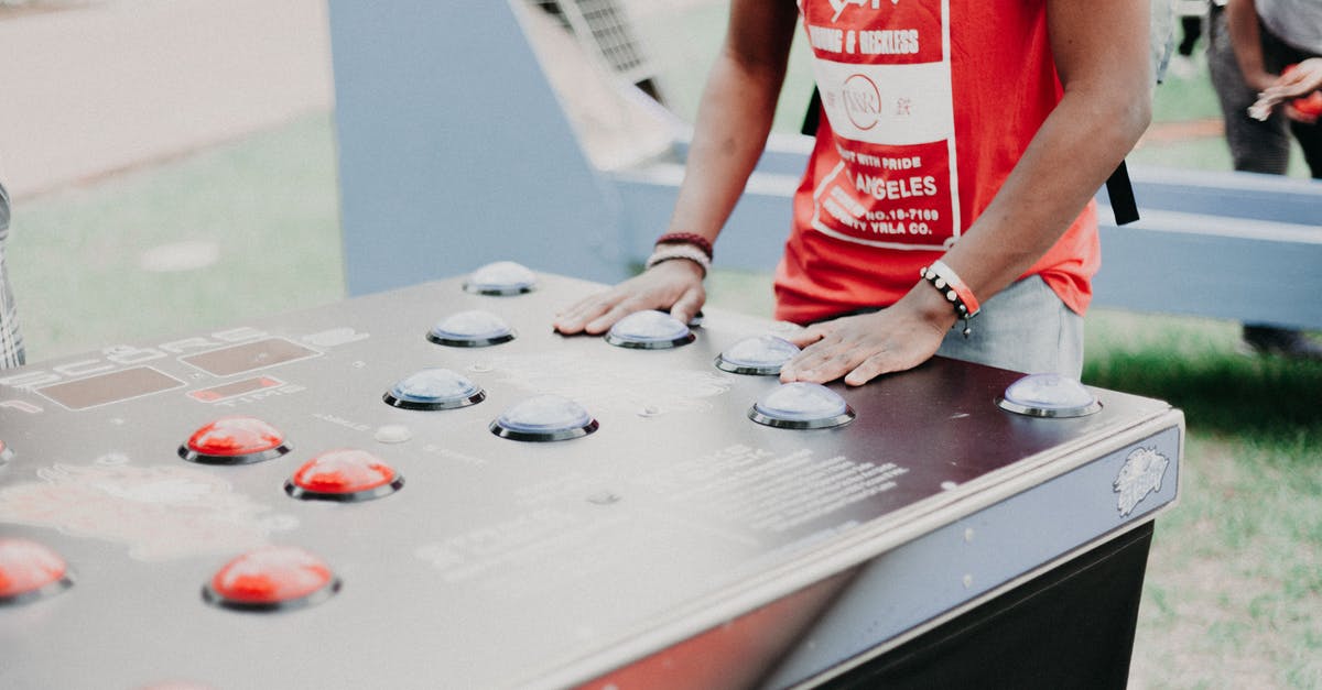PS4 buttons do not work in-game? - Person Wearing Red and White T-shirt
