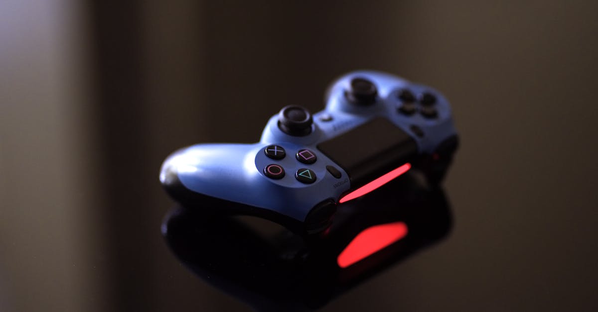 PS4 controller not pairing with system [duplicate] - Blue Sony Ps4 Controller on Black Surface