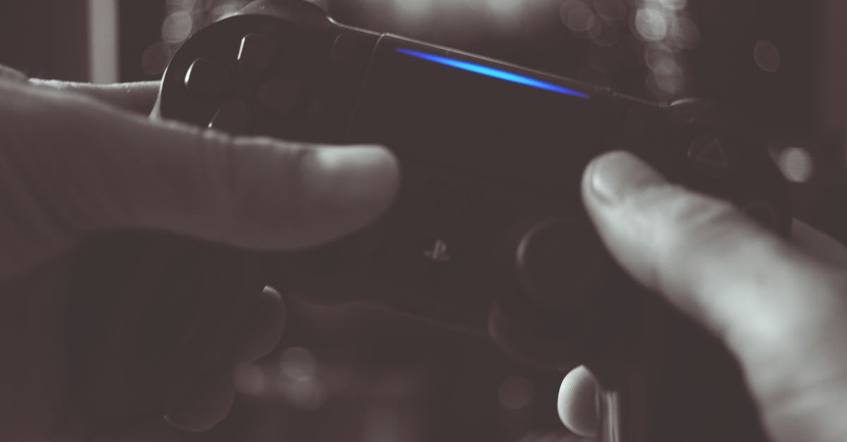 PS4 controller not pairing with system [duplicate] - Black And White Photo Of Man Holding Sony Ps4 Wireless Controller