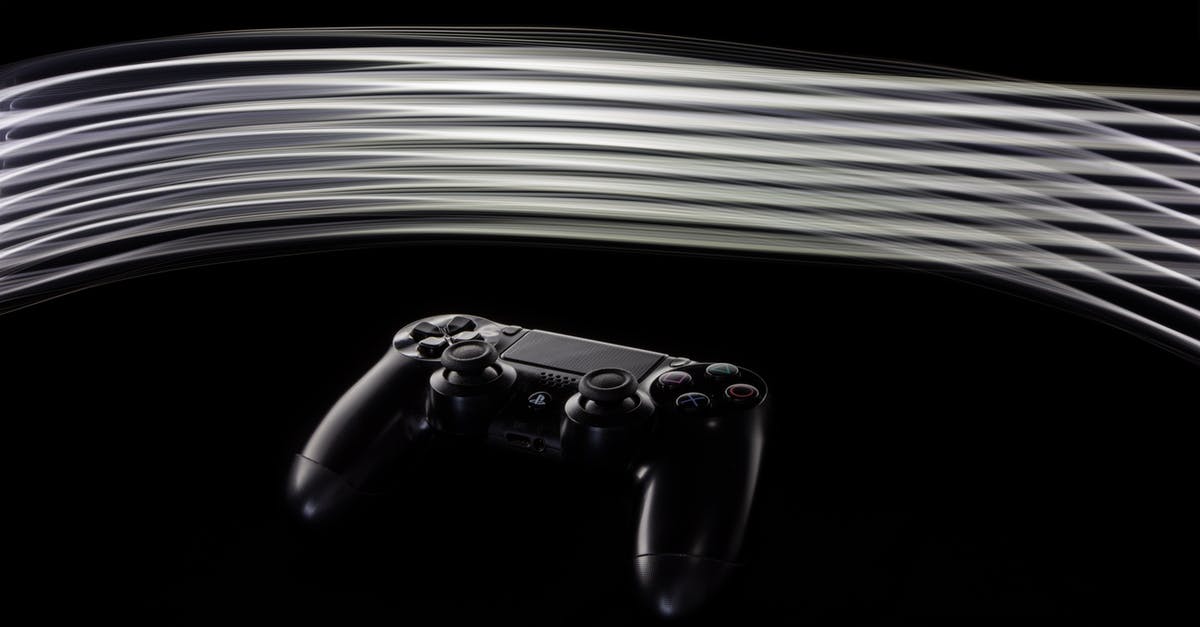 PS4 controller shows up wired, but not on bluetooth for Windows 10 [duplicate] - Close-Up Shot of Playstation Controller