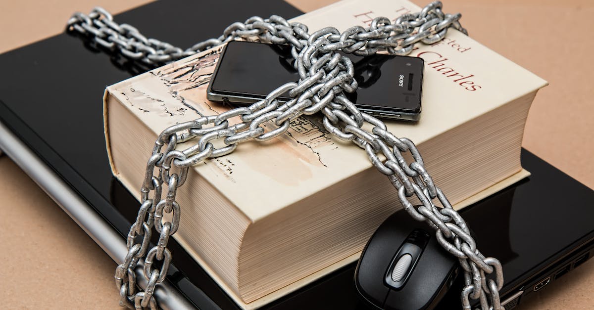PS Vita and PSN: Limit purchasing ability - Black Android Smartphone on Top of White Book PS Vita and PSN: Limit purchasing ability - Black Android Smartphone on Top of White Book