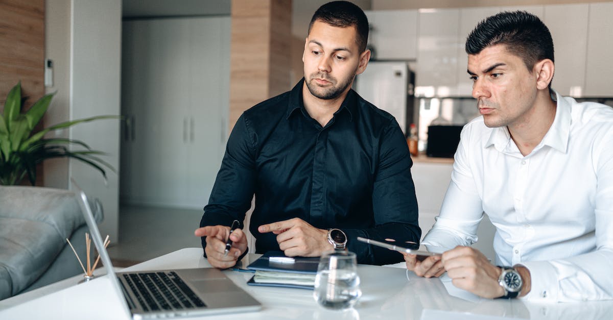 Psionics in XCOM (ipad version) - Man in Black Dress Shirt Holding Pen and Macbook Pro