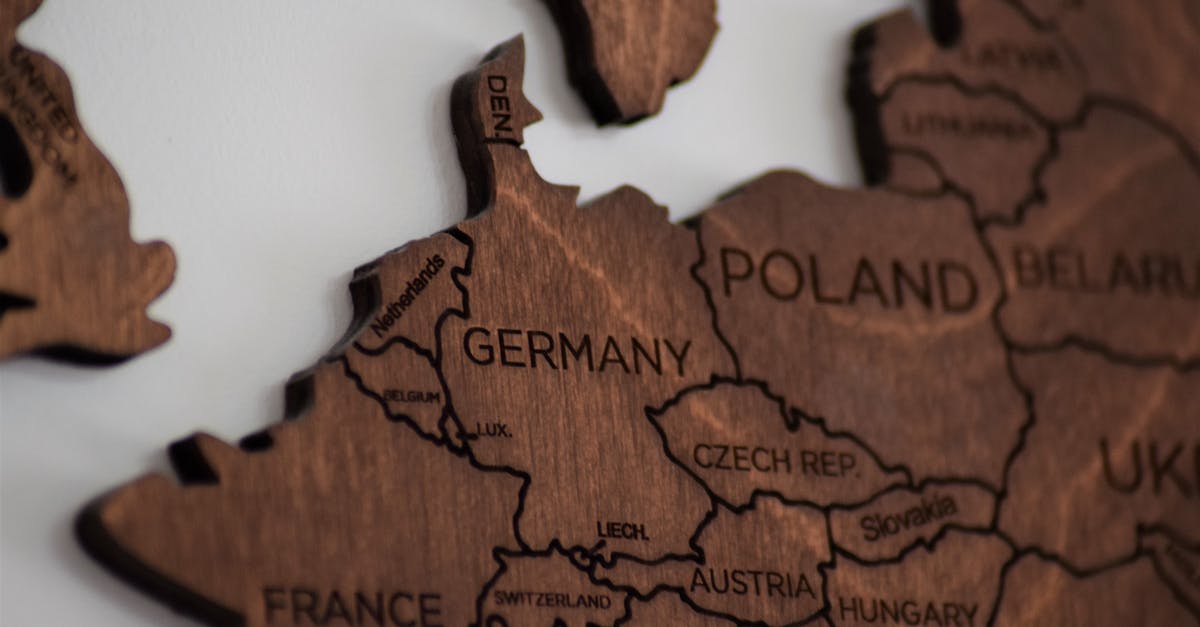 PSN Germany to Belgium transfer - Close-Up Photo of Wooden Jigsaw Map