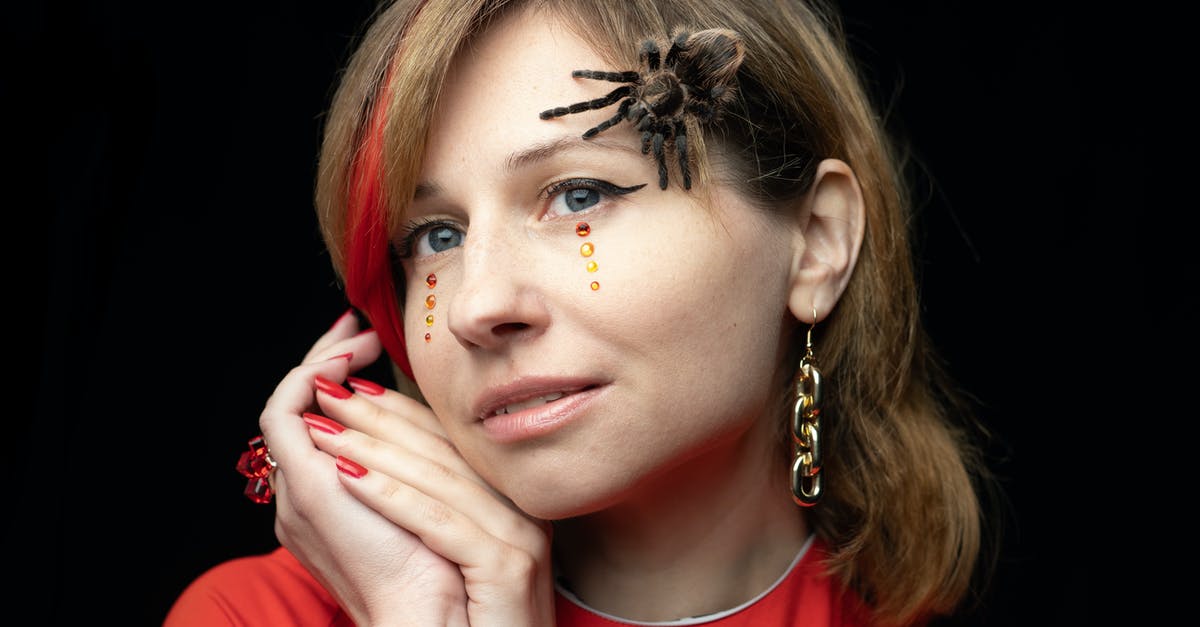 Purifier and 'appearing as witchcraft user': what happens? - Spooky spider on face of young woman