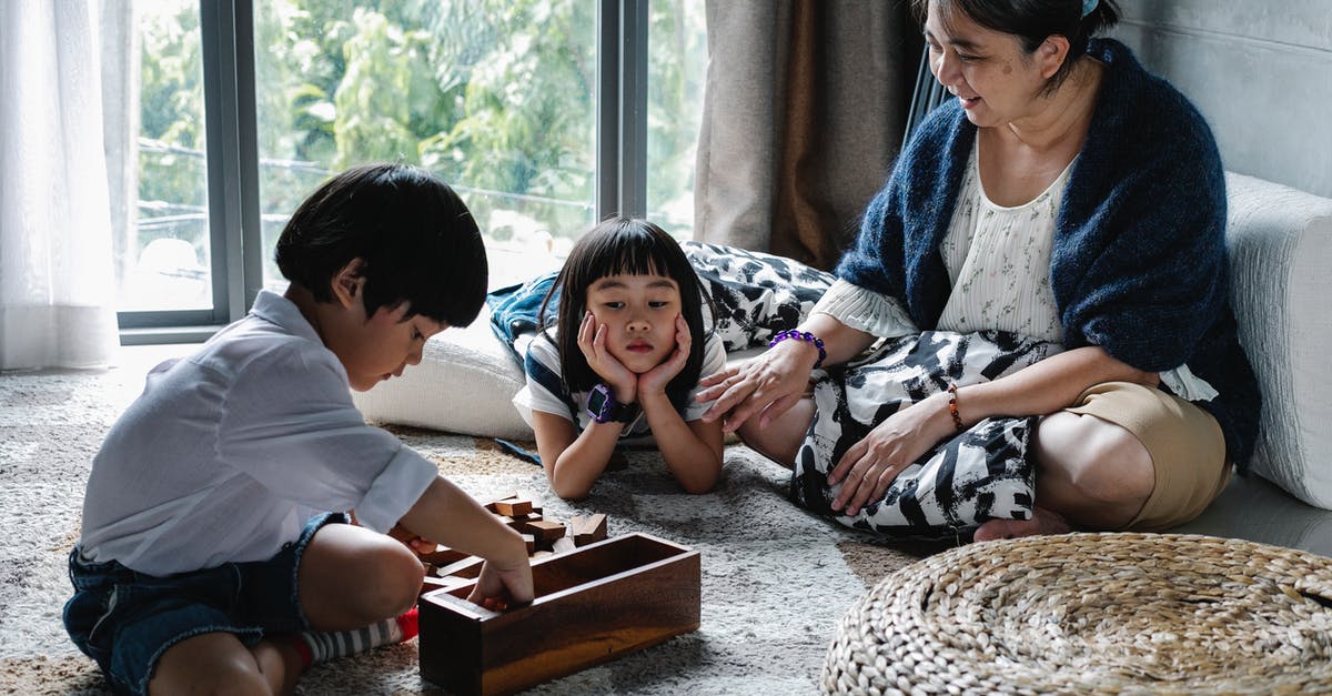 PvZ 2: Charge-up Time at the Beginning of Game - Upset ethnic kid looking at brother picking up blocks after playing game with grandmother PvZ 2: Charge-up Time at the Beginning of Game - Upset ethnic kid looking at brother picking up blocks after playing game with grandmother