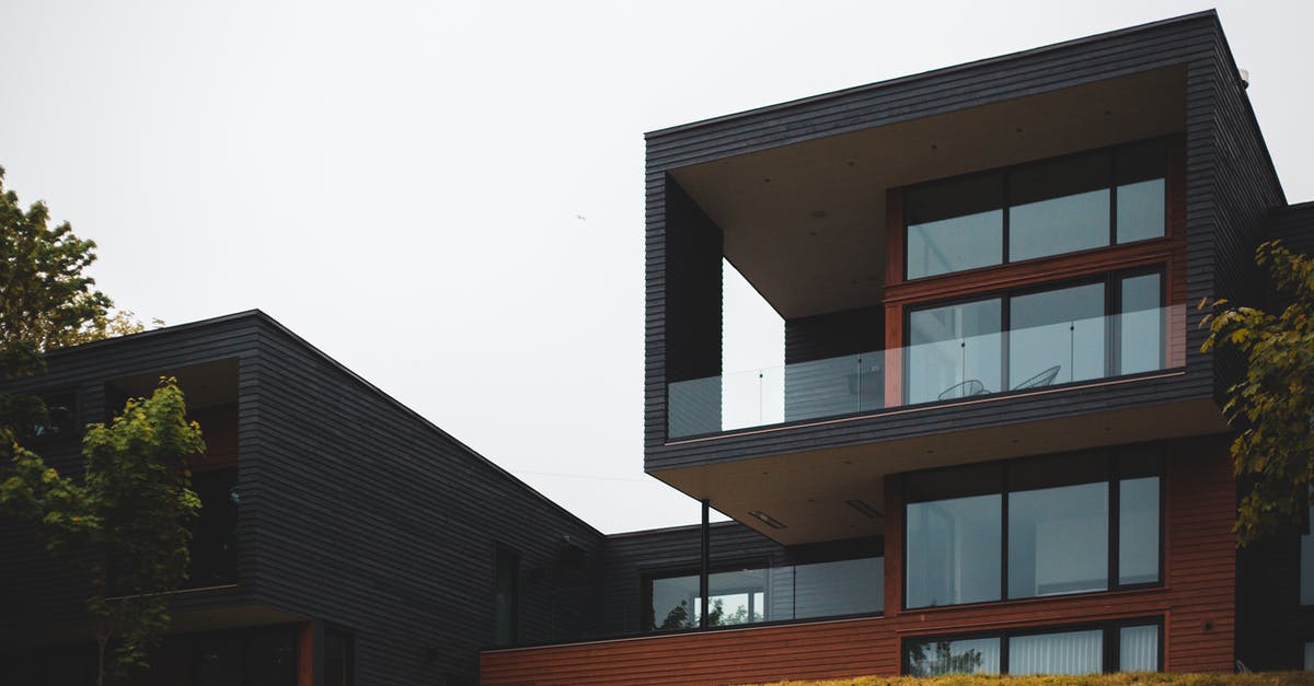 pwnhammer not dropping from the wall of flesh - From below of contemporary geometric building with big windows and stylish design of balcony on green grass with trees pwnhammer not dropping from the wall of flesh - From below of contemporary geometric building with big windows and stylish design of balcony on green grass with trees