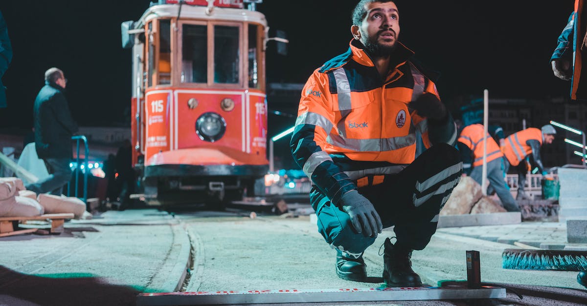 Quest 'Strange beast': Talk to Thorleif fails when you reach the ambush site - Man in Orange and Black Zip Up Jacket and Black Pants Sitting on Red and Yellow