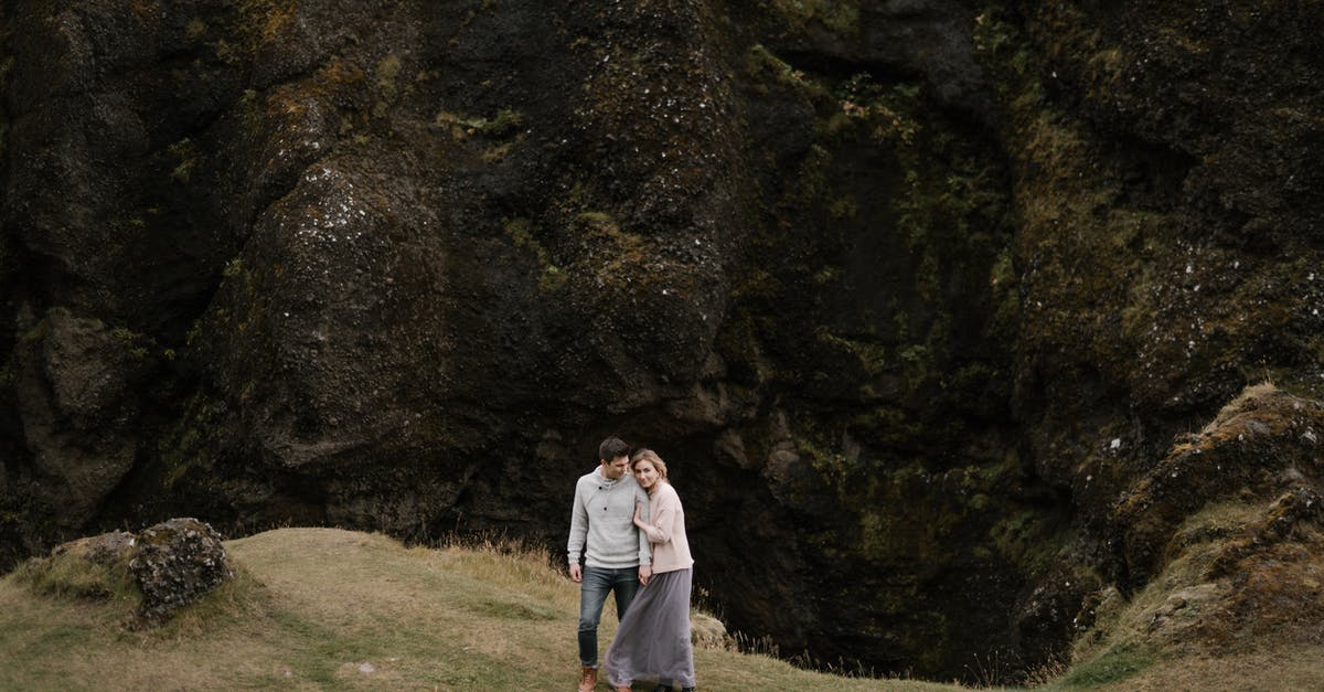 "Downloads are not supported on this device" from Edge Browser - From above of cuddling young couple standing together on edge of huge rocky cliff