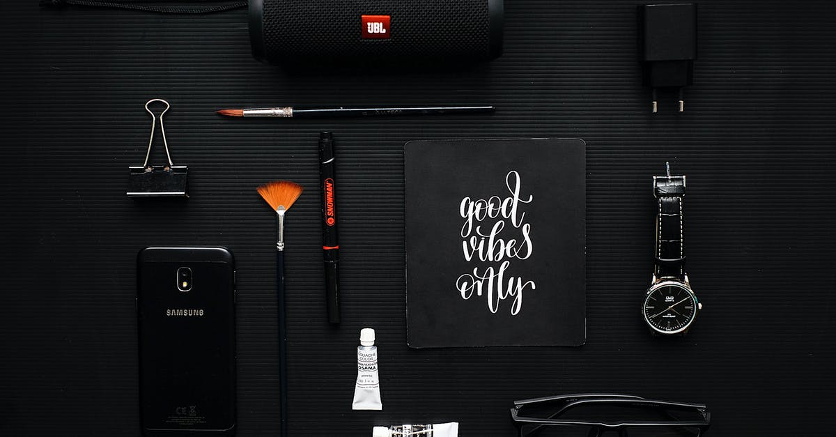 Quotes ignore brackets - Close-up Photography of Smartphone Beside Binder Clip, Speaker and Eyeglasses on Black Textile