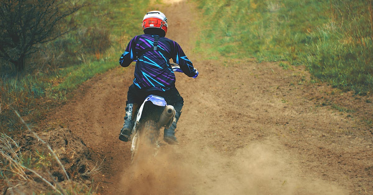 Race Start Mode of Gran Turismo 5 - Man Riding Motocross Dirt Bike on Dirt Road