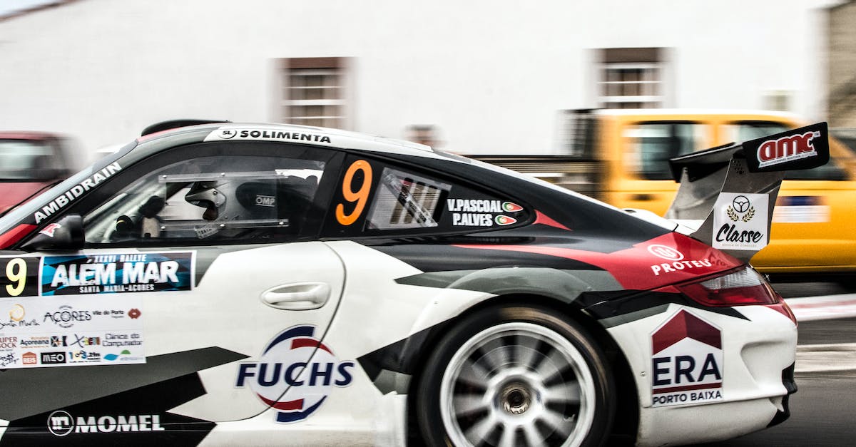 Racing wheel pulls to the right / How to fix? - Photography of Person Driving Porsche