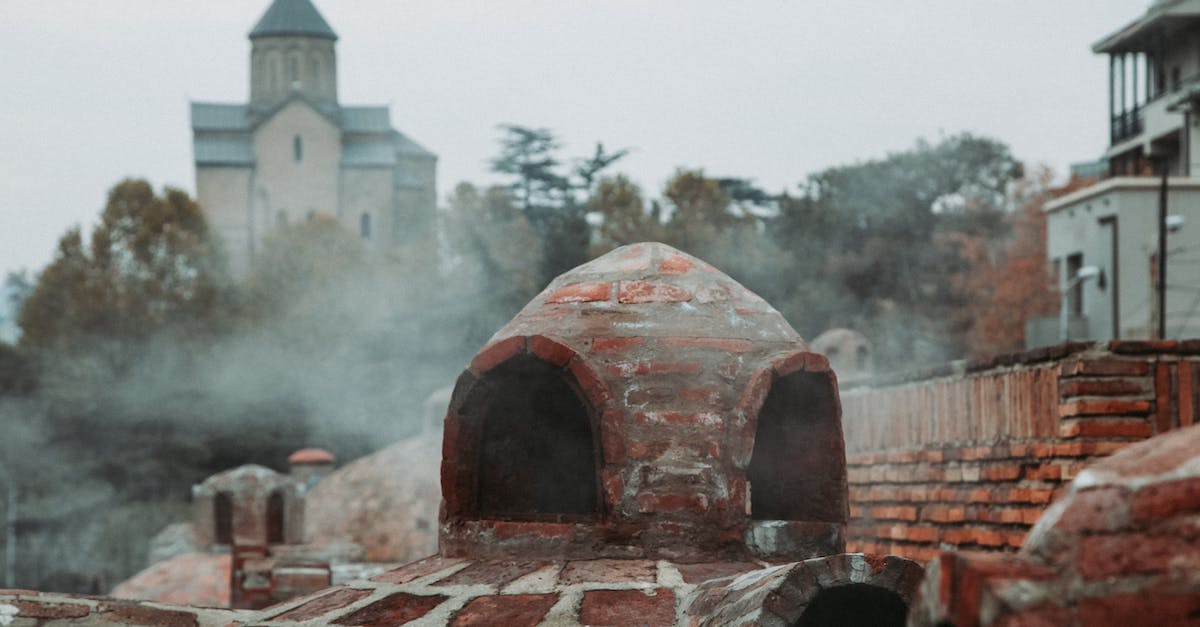 Radiance and Song of Flame - Brown Brick Building With Smoke Radiance and Song of Flame - Brown Brick Building With Smoke