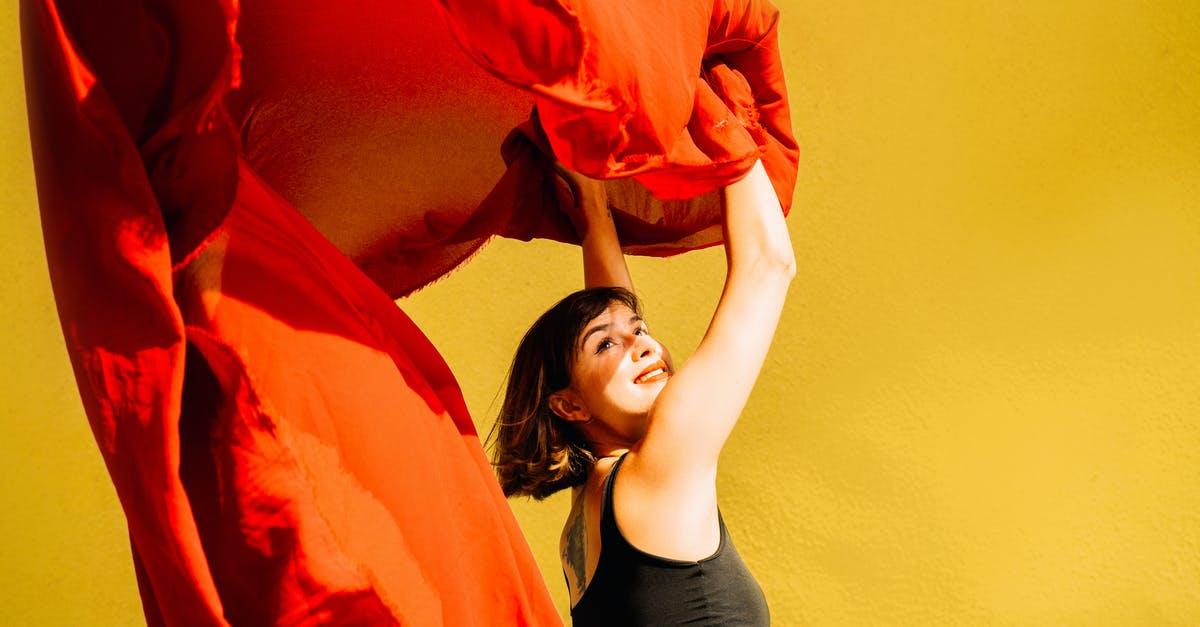 Raising a dweller's happiness - Happy Woman Holding Red Cloth Raising a dweller's happiness - Happy Woman Holding Red Cloth