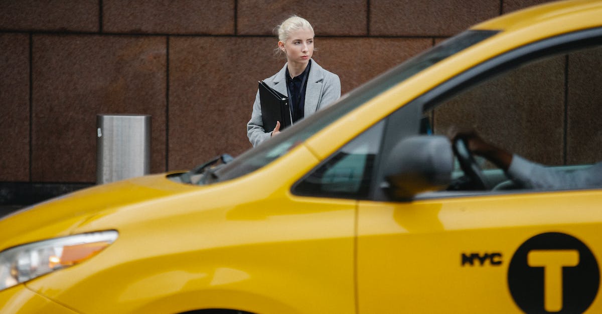 R&D center is closed in career - Pensive woman with folders standing near taxi R&D center is closed in career - Pensive woman with folders standing near taxi