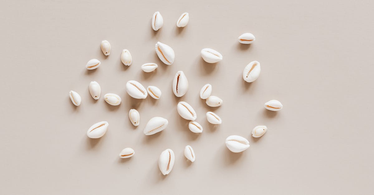 Random unmoving skeletons spawning all over? - Top view composition of shells assorted sizes arranged randomly on beige surface Random unmoving skeletons spawning all over? - Top view composition of shells assorted sizes arranged randomly on beige surface