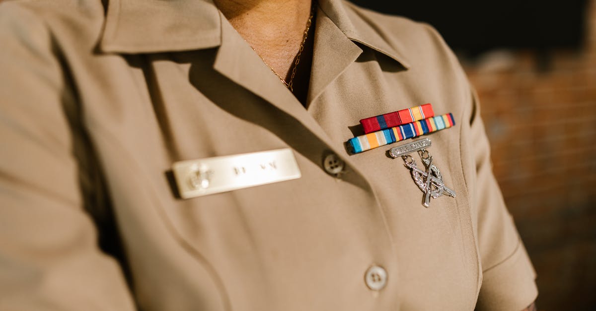 Ranking up more ranks? - Close-Up Photo of Person Wearing Beige Military Uniform Ranking up more ranks? - Close-Up Photo of Person Wearing Beige Military Uniform