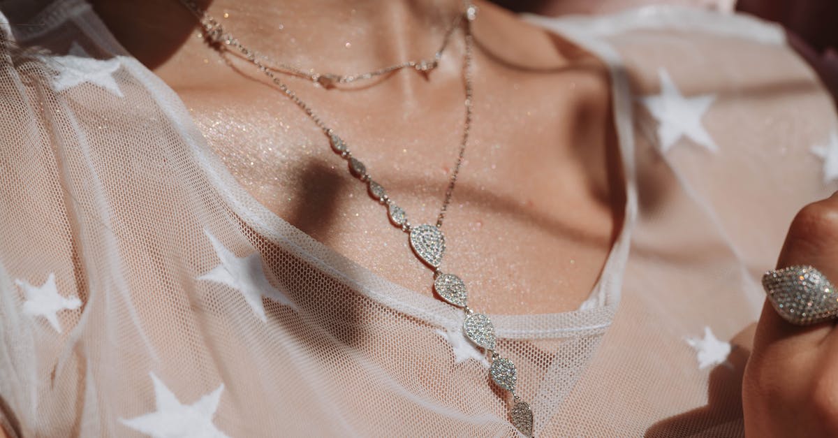 Ranks names in Diamond Mine - Woman Wearing Silver Necklace and White Shirt