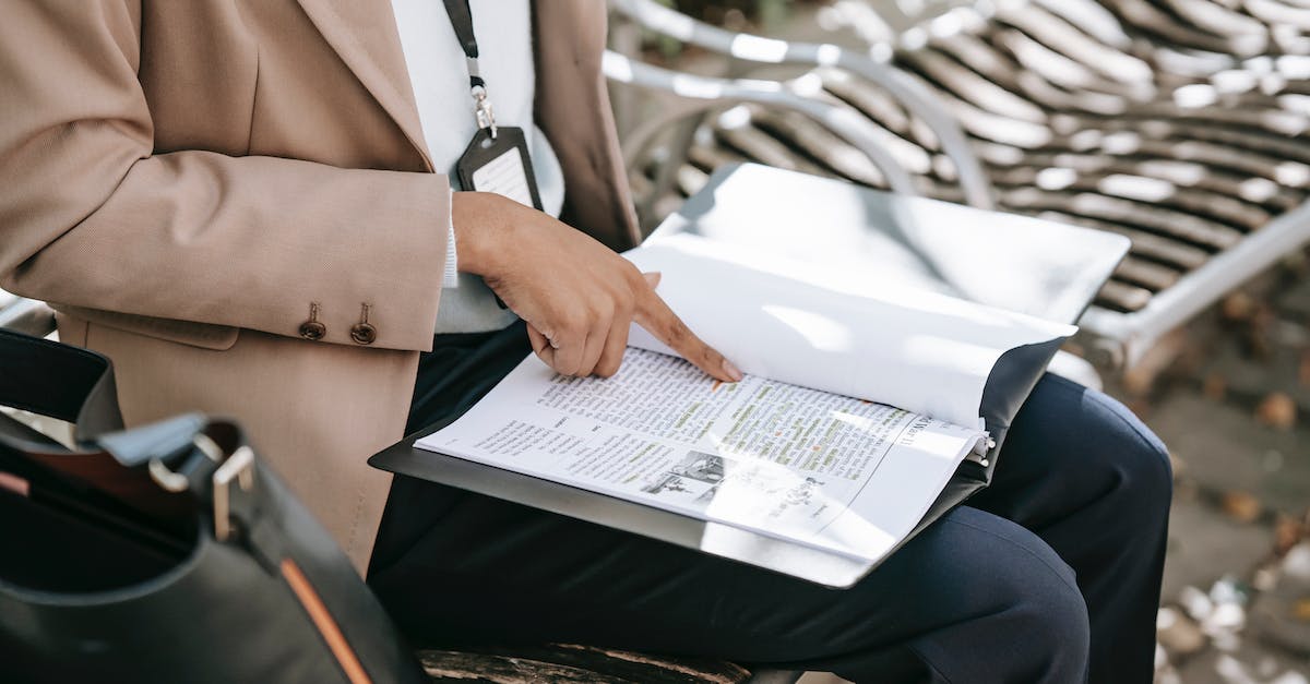 Read (Console) Variables and print them - Crop woman reading text on paper Read (Console) Variables and print them - Crop woman reading text on paper