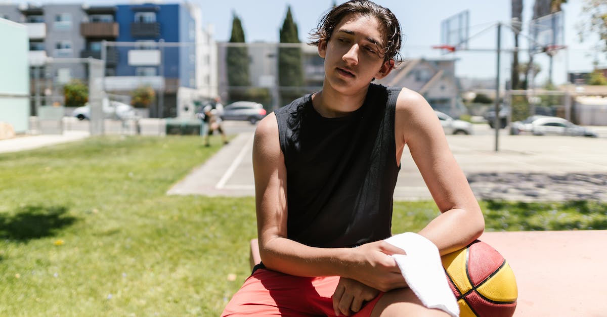 Receiving player and hero level 2 rewards on higher levels - Young Man resting his Arm on a Basketball 
