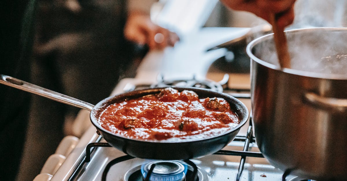 Recently activated a product on steam that is already installed via disk. Can I move it to steam? [duplicate] - Crop unrecognizable person stirring boiling water in saucepan placed on gas stove near frying pan with appetizing meatballs in tomato sauce