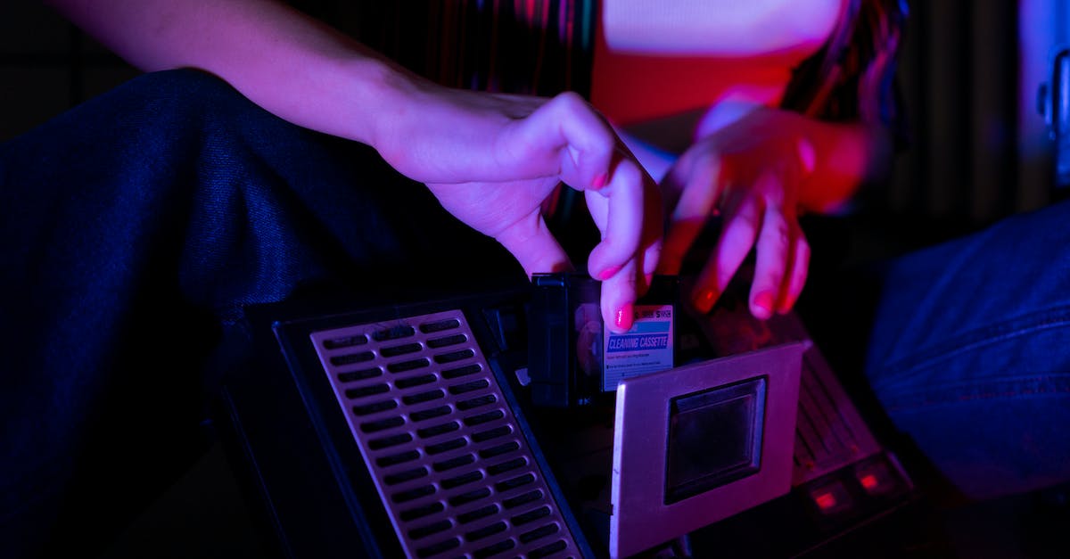 Recording all player interactions for spectating/video recording later in Team Fortress 2? - Person Holding A Black Cassette Tape