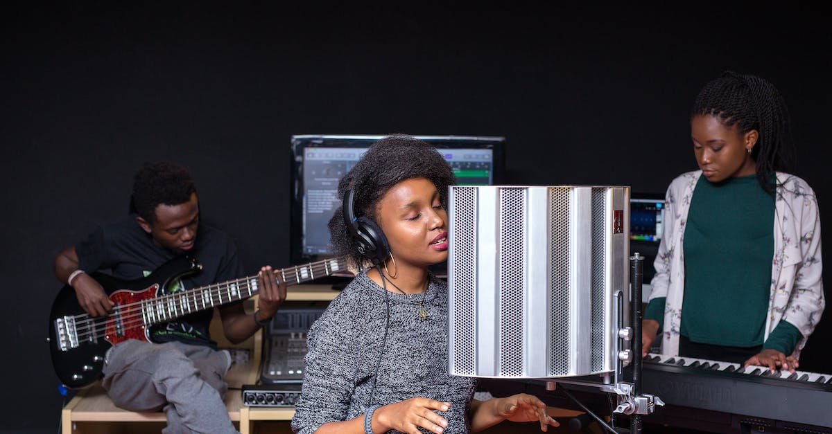 Recording at 60 FPS - Man in Gray Dress Shirt Playing Guitar Recording at 60 FPS - Man in Gray Dress Shirt Playing Guitar