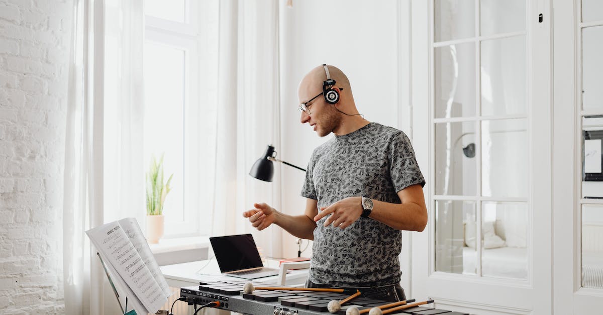 Redeem keys without downloading - Man Looking at Music Sheet