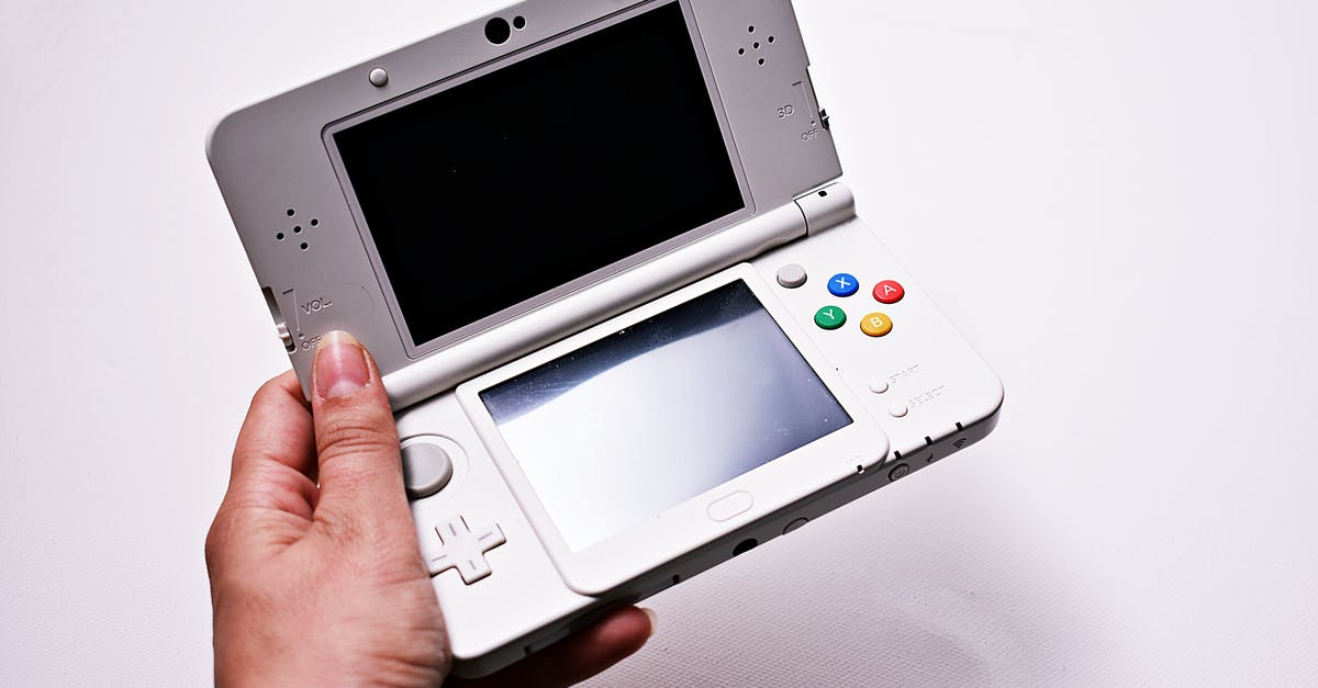 Redeeming a 3DS game code without installing the game? - Person Holding Gray Nintendo Gameboy Advance