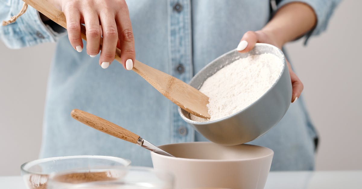Reliably mix 3 ingredients for a factory - Person Adding Flour into a Bowl