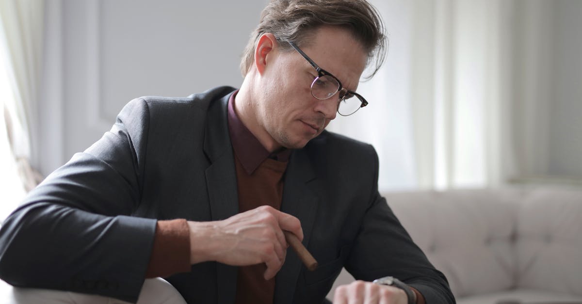 Reload Time in World of Tanks? - Photo of Man in Black Suit Sitting on White Couch Smoking a Cigar While Looking at the Time Reload Time in World of Tanks? - Photo of Man in Black Suit Sitting on White Couch Smoking a Cigar While Looking at the Time