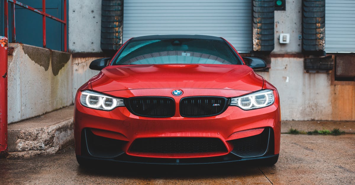 Repair or rebuild Signal Interceptor after quest? - Modern expensive red car with shiny headlights parked near rusty shabby auto service