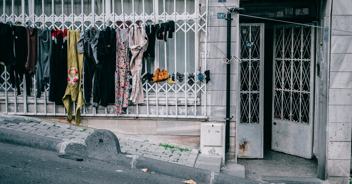 Replace normal block with same block that has a special property - Laundry drying on clothesline near condominium entrance Replace normal block with same block that has a special property - Laundry drying on clothesline near condominium entrance