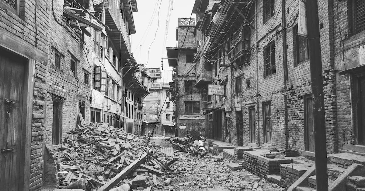 Requirements for a clan war? - Woman in Black Hijab Standing Beside Gray Concrete Fire Pit