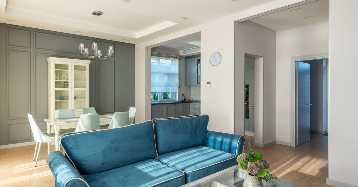 Reset Trove house/cornerstone - Blue and White Couch Beside White Wooden Table Reset Trove house/cornerstone - Blue and White Couch Beside White Wooden Table